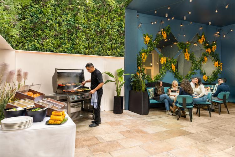Enclosed courtyard a the Morgan hotel with table and chair perfect for spring and summer dining