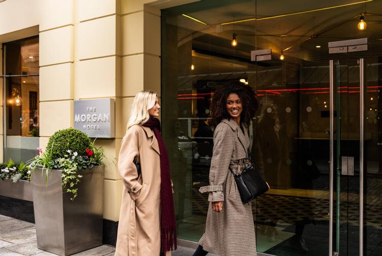 Girls entering The Morgan Hotel, city centre hotel in Dublin, Ireland, located in the heart of Temple Bar